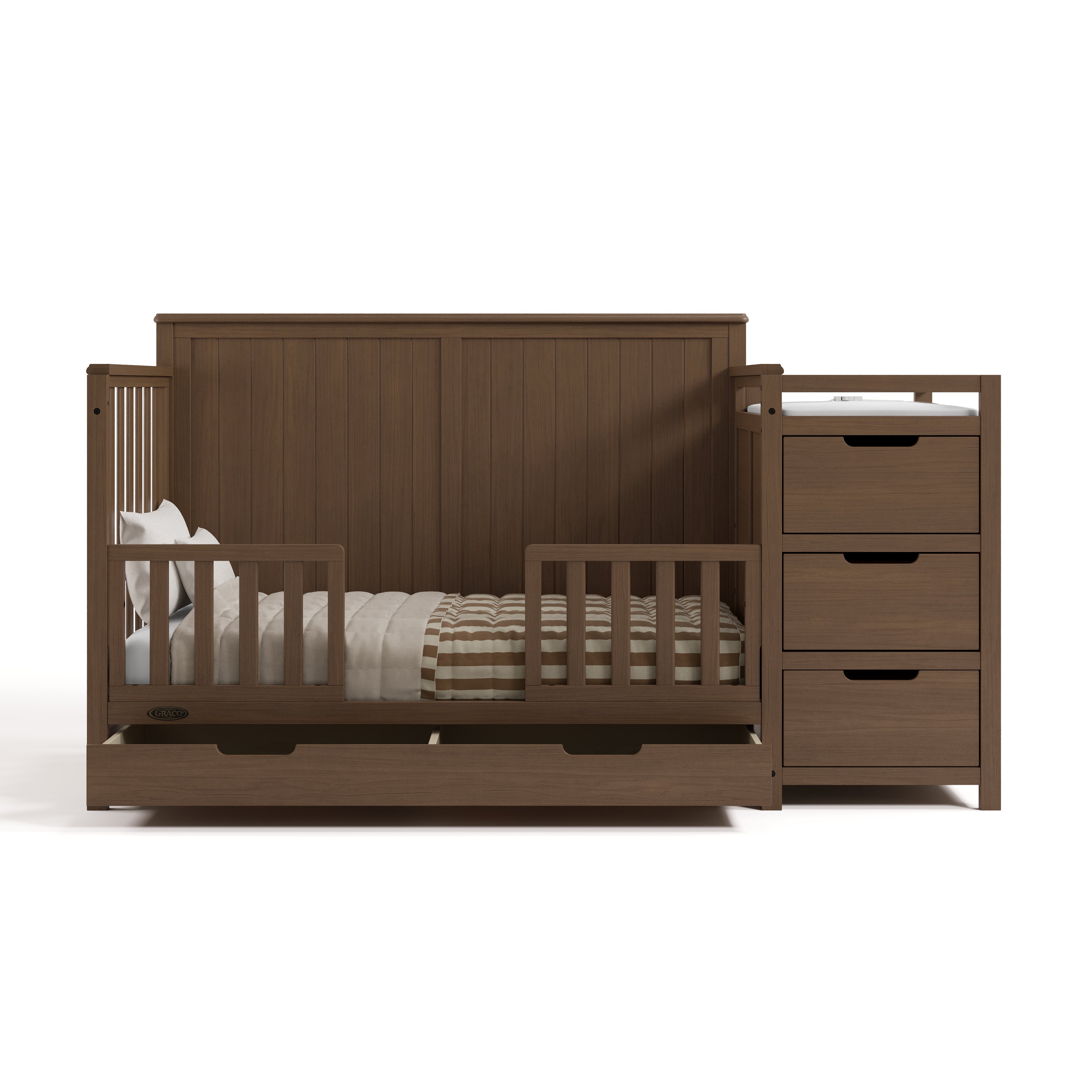 Hadley hazelnut crib and changer converted to toddler bed with two guardrails