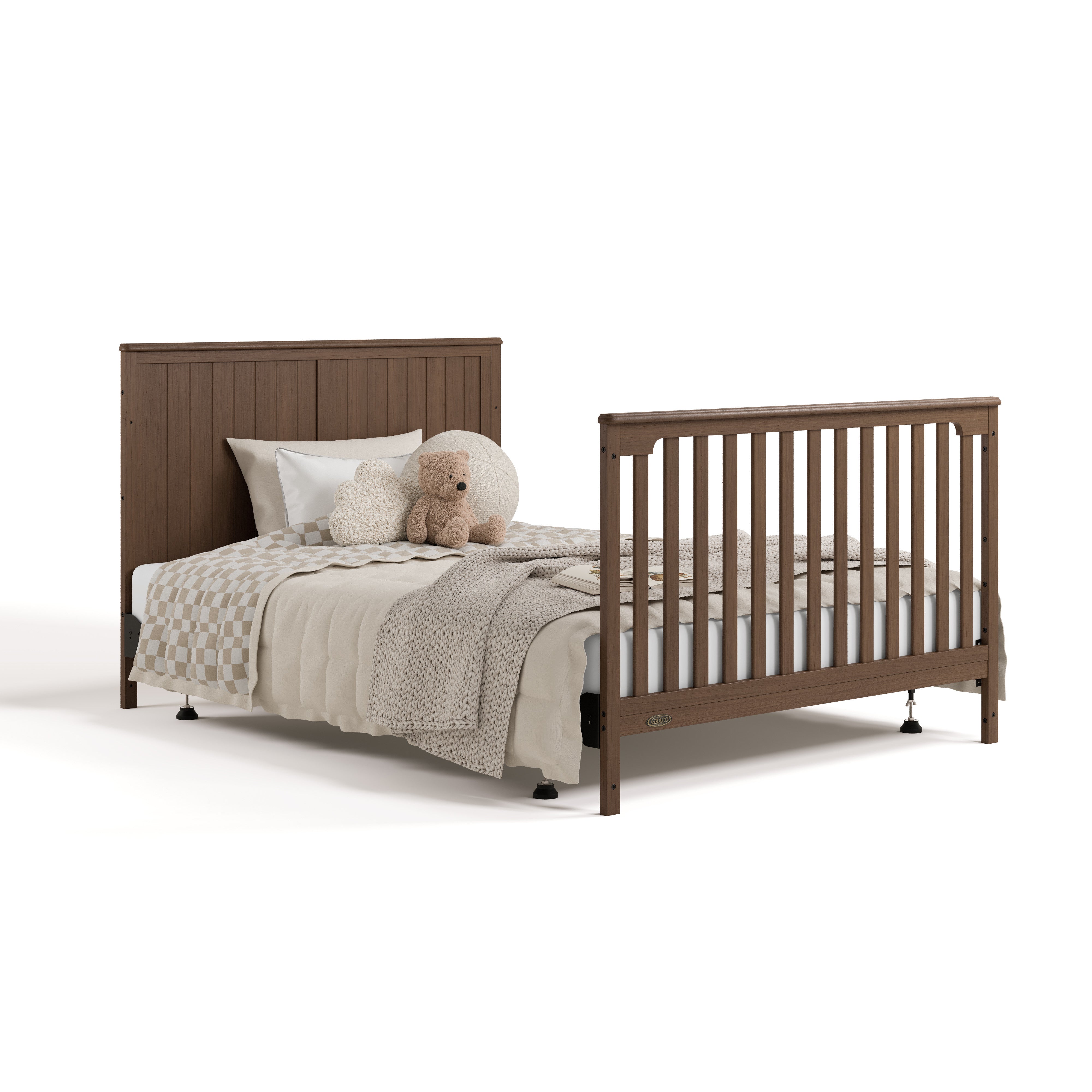 Hadley hazelnut crib and changer converted to full-size bed with footboard