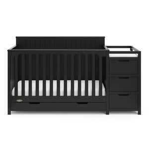 Front view of black crib with drawer and changer with drawer