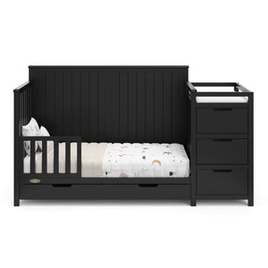 black crib and changer with drawer in toddler bed conversion with one safety guardrail