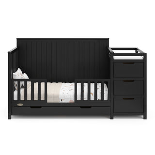 black crib and changer with drawer in toddler bed conversion with two safety guardrail