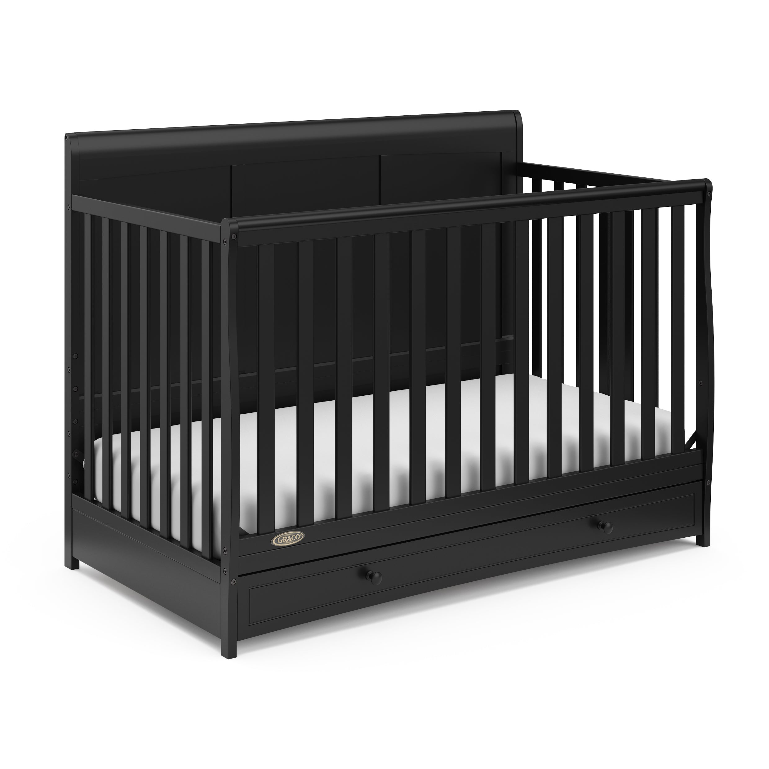Angled view of black crib with drawer