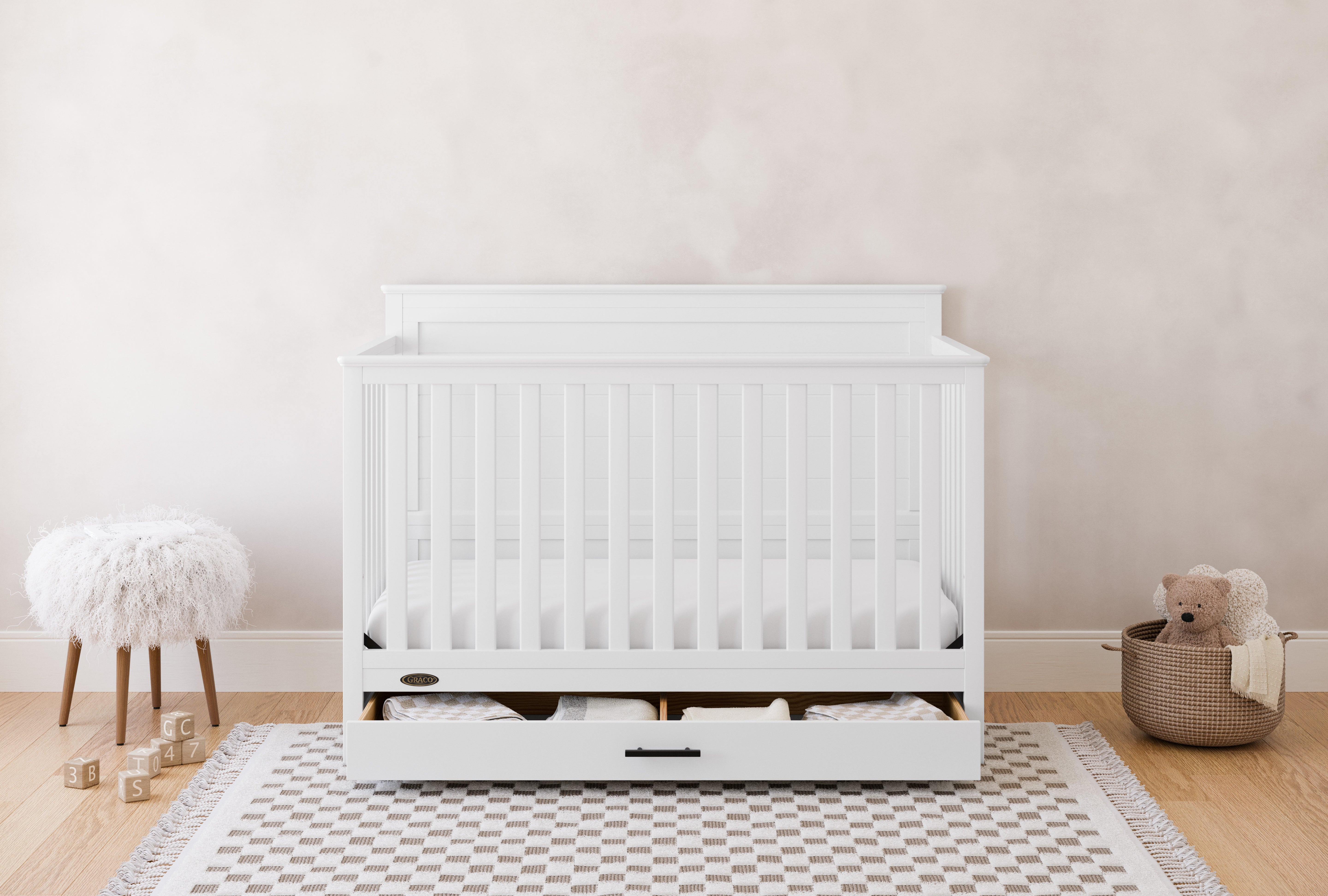 graco tristan white crib with drawer in nursery