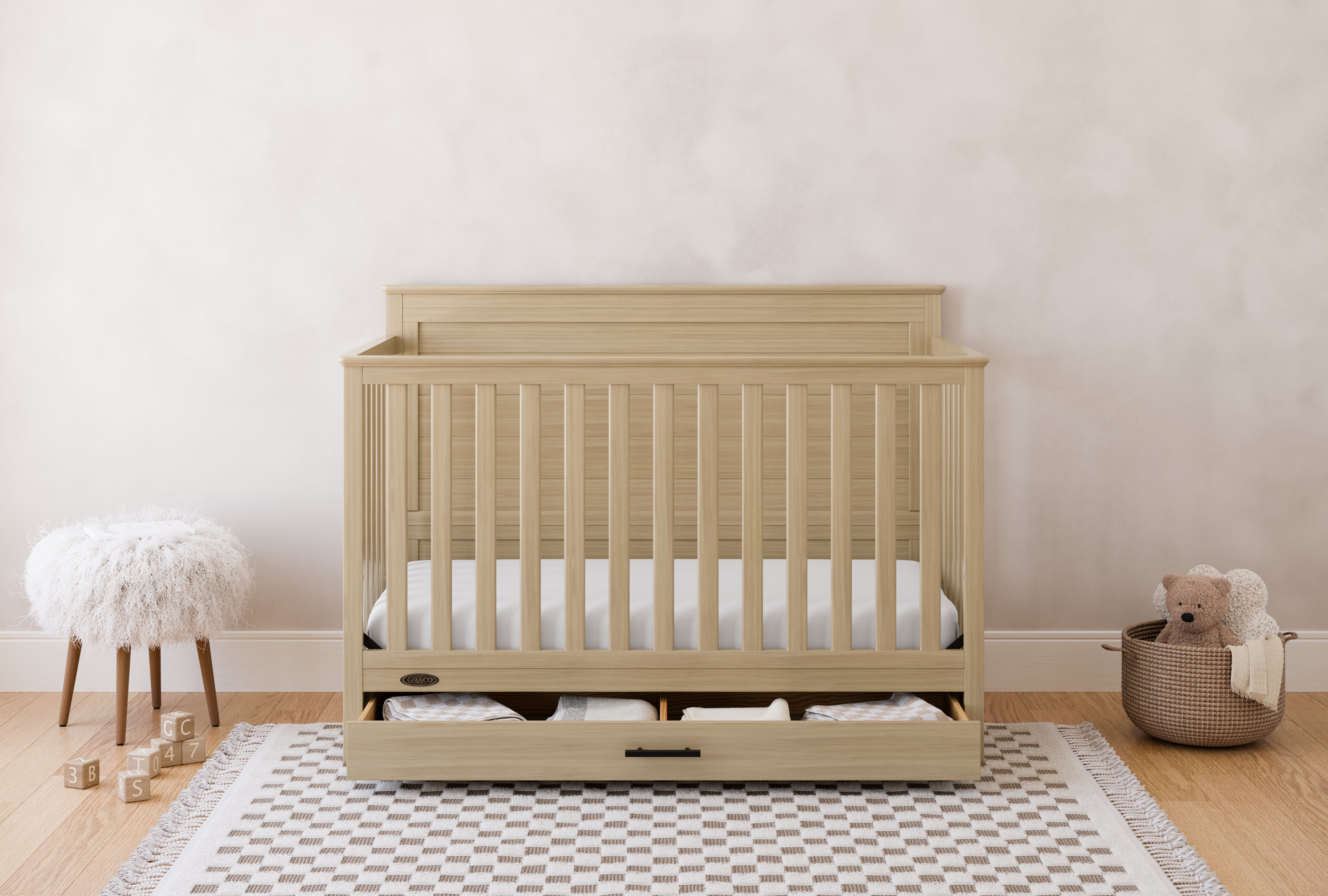 Graco® Tristan™ Convertible Crib With Drawer.