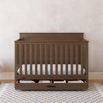 graco tristan hazelnut crib with drawer in nursery