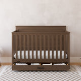 graco tristan hazelnut crib with drawer in nursery
