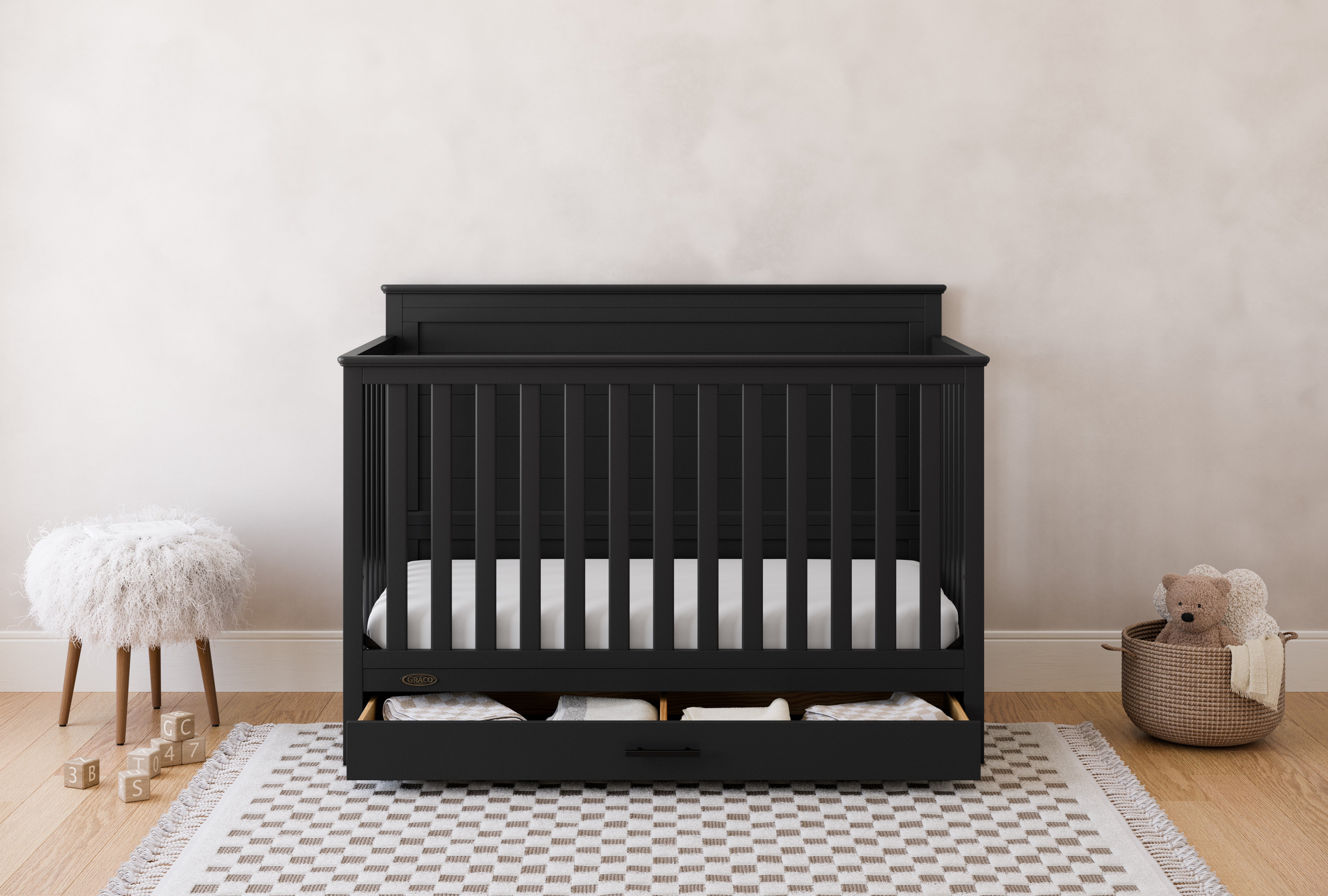 graco tristan black crib with drawer in nursery