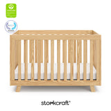 Beckett natural crib with GGG and PTPA logo on top left