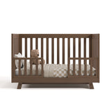 Beckett hazelnut crib converted to toddler bed with two guardrails