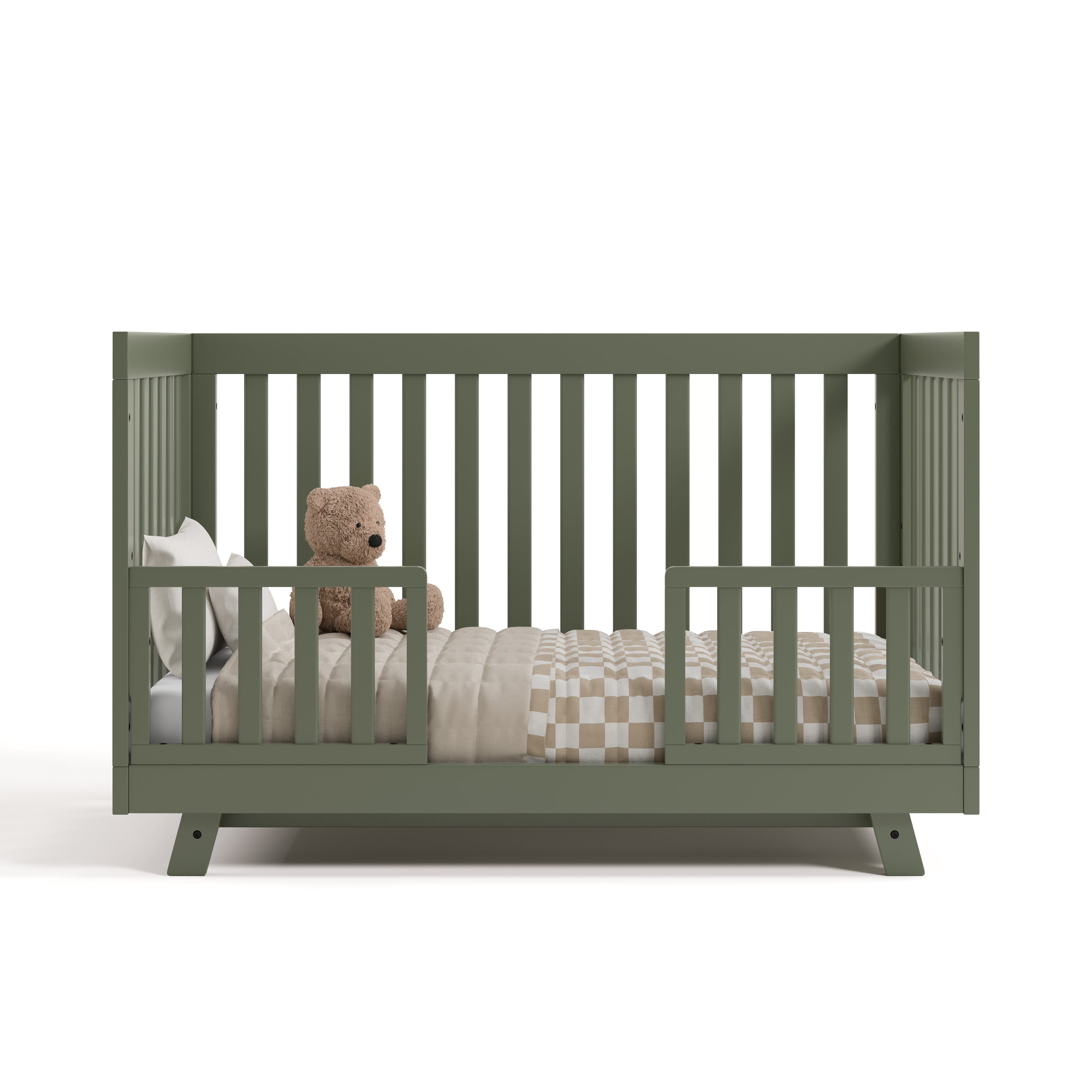 Beckett olive crib converted to toddler bed with two guardrails
