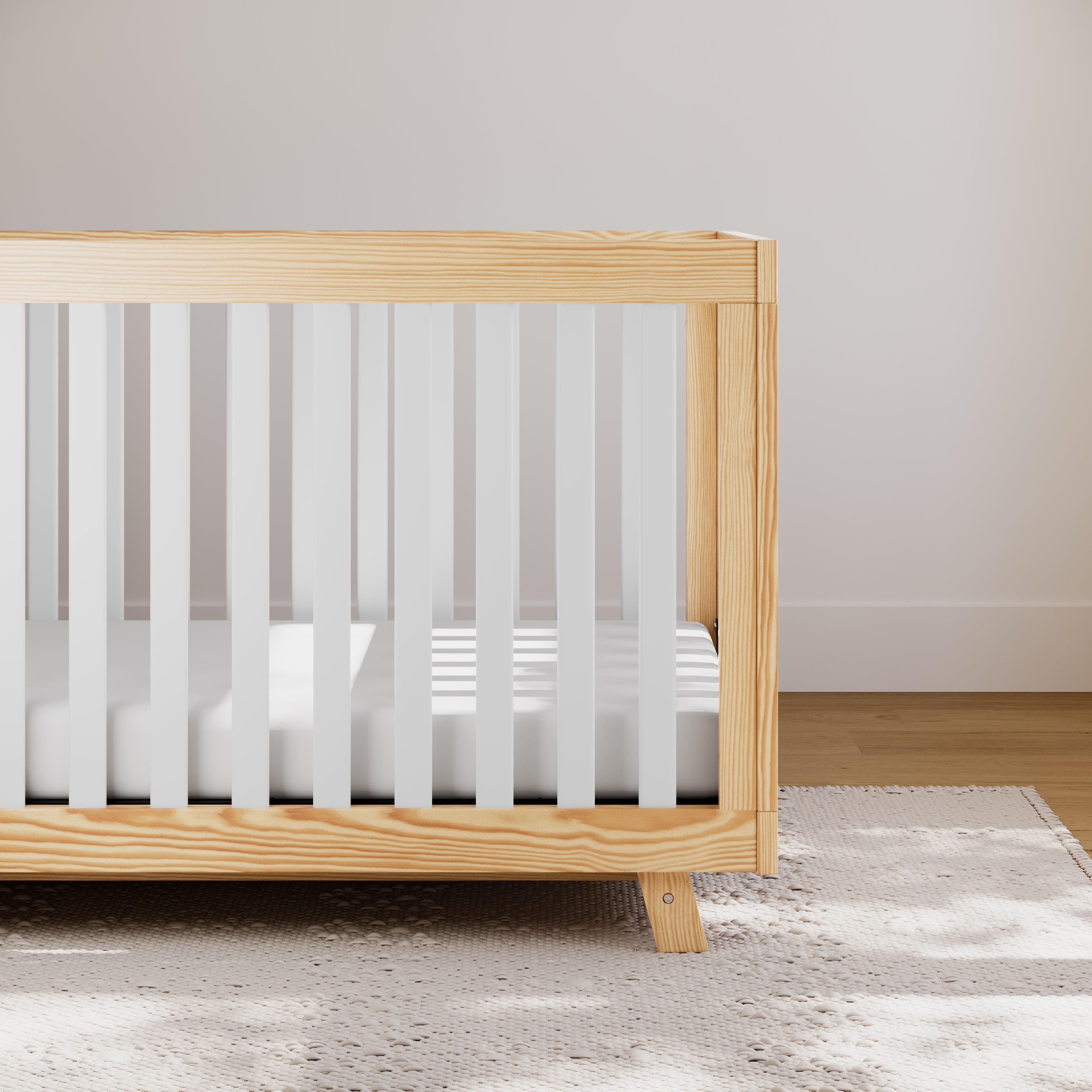 storkcraft beckett natural with white crib in nursery