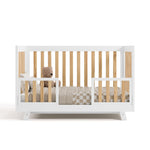 Beckett crib in white with natural converted to toddler bed with two guardrails