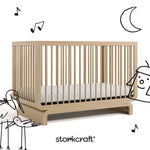 Santorini driftwood crib with black cartoon drawings