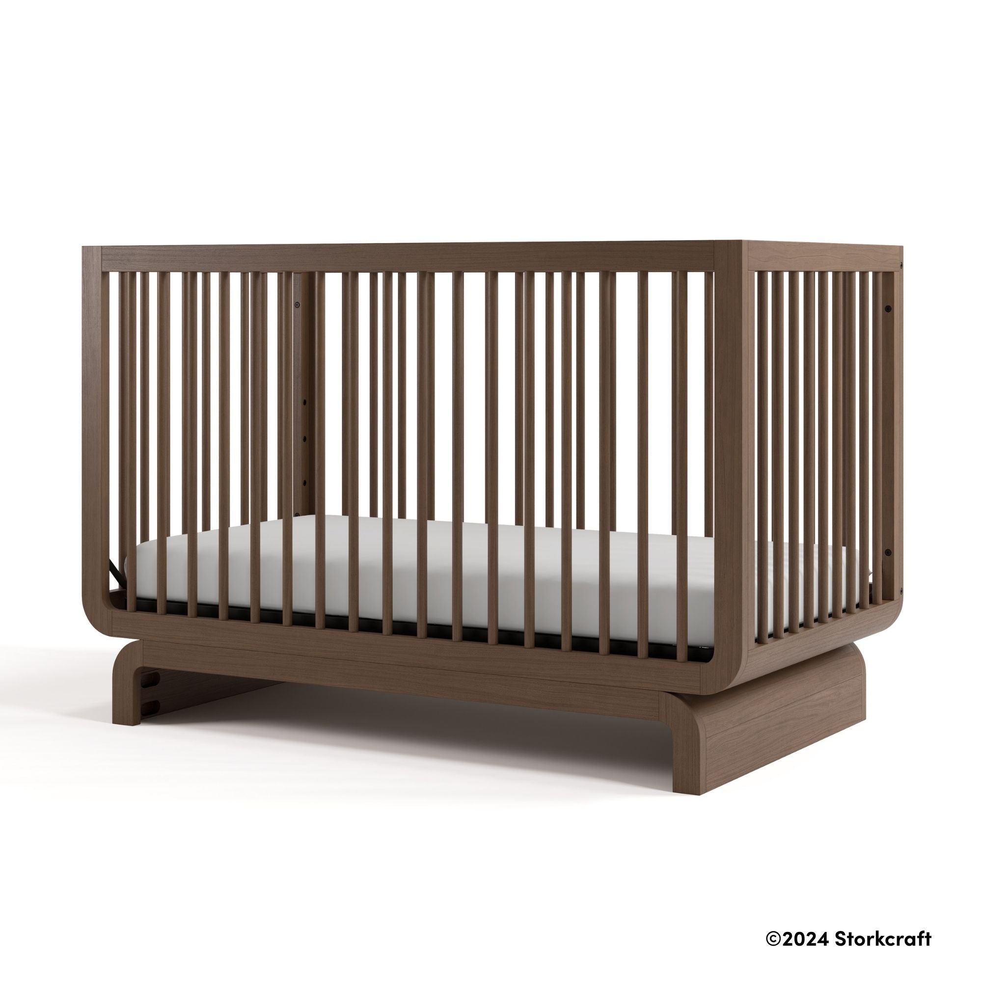 Santorini hazelnut crib with 2024 Storkcraft copyright on bottom right