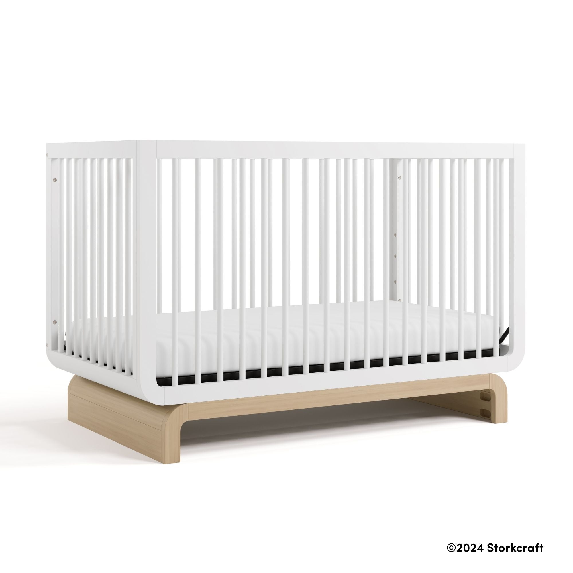 Santorini white with driftwood crib with 2024 Storkcraft copyright on bottom right