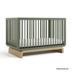 Santorini olive with driftwood crib with 2024 Storkcraft copyright on bottom right