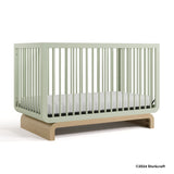 Santorini sage with driftwood crib with 2024 Storkcraft copyright on bottom right