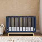 Santorini midnight blue with driftwood crib in a nursery