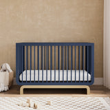 Santorini midnight blue with driftwood crib in a nursery