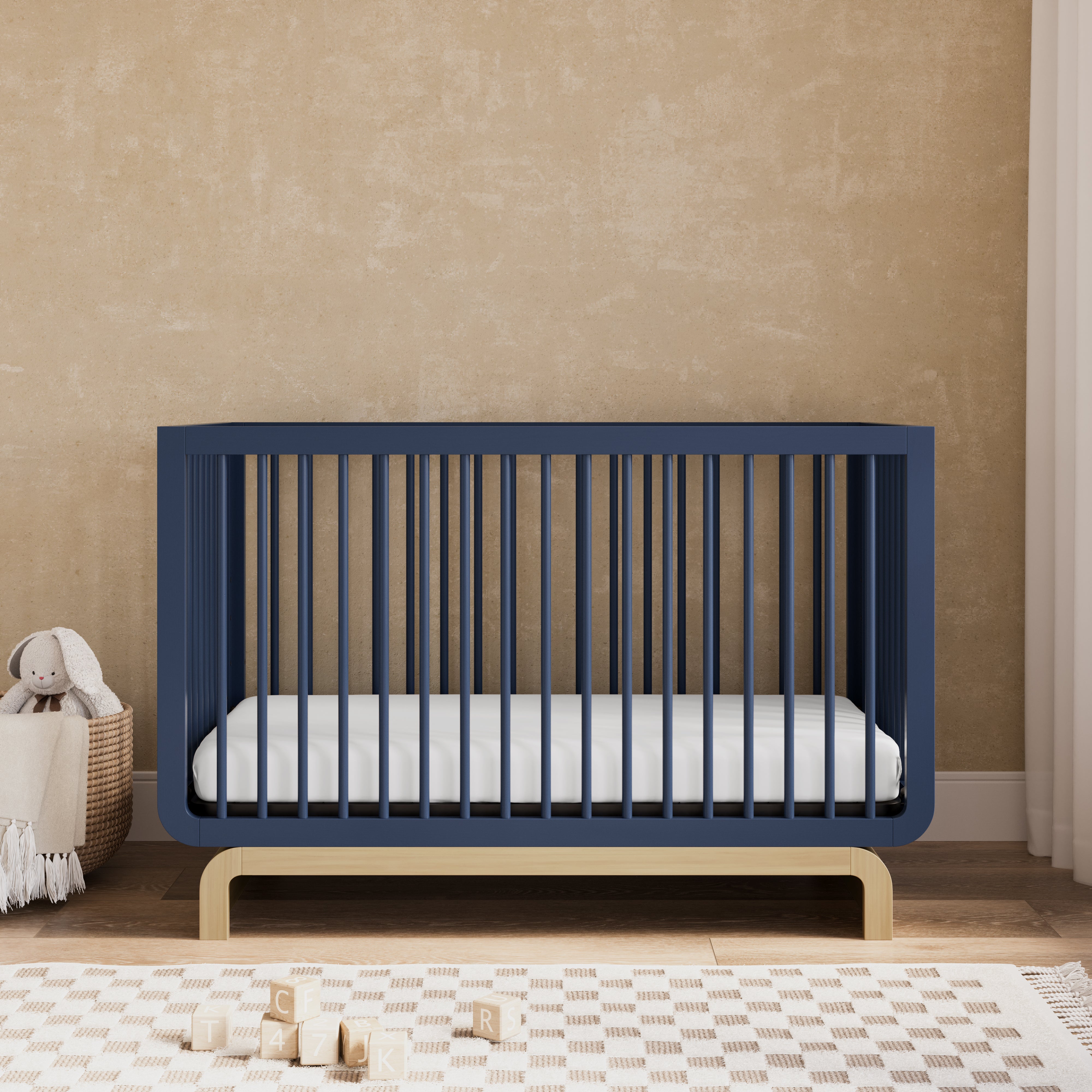 Santorini midnight blue with driftwood crib in a nursery