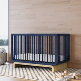 Santorini midnight blue with driftwood crib in a nursery