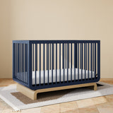 Santorini midnight blue with driftwood crib in a nursery