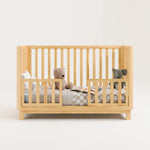 storkcraft santos natural crib studio toddler bed conversion with two guardrails