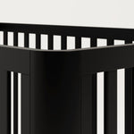 3-in-1 black convertible crib side corner view