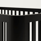 3-in-1 black convertible crib side corner view