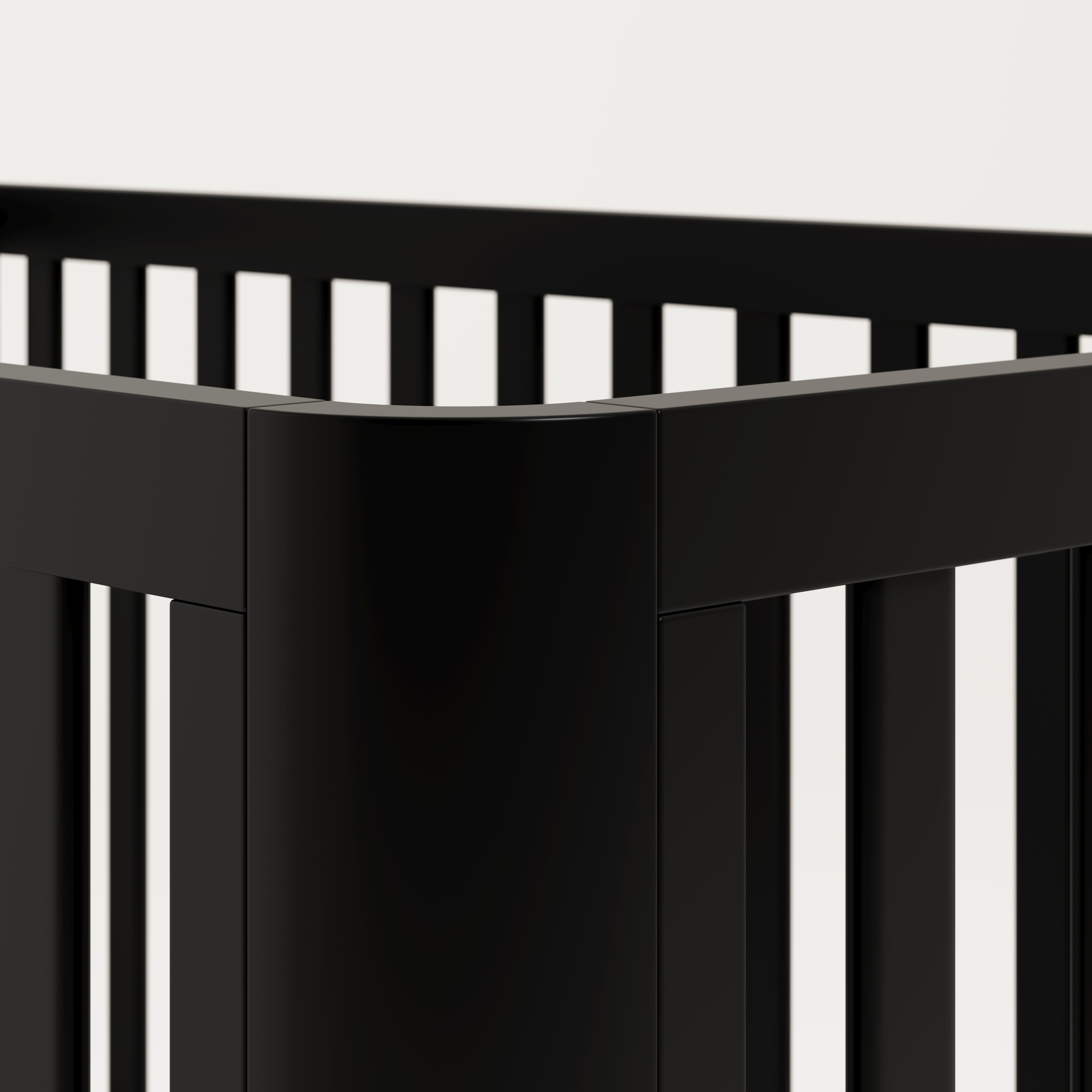 3-in-1 black convertible crib side corner view