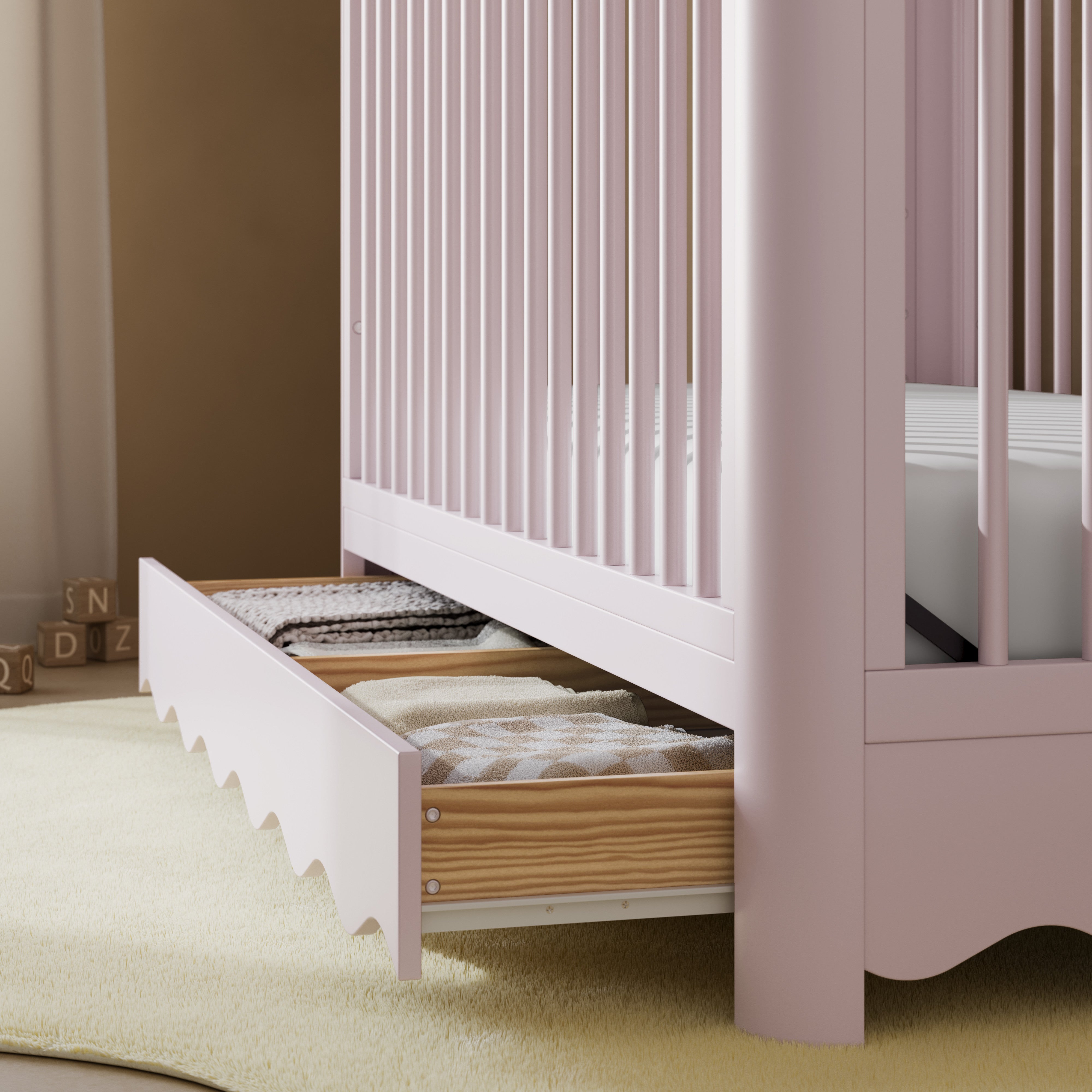 Casablanca blush crib with drawer close up of drawer in nursery