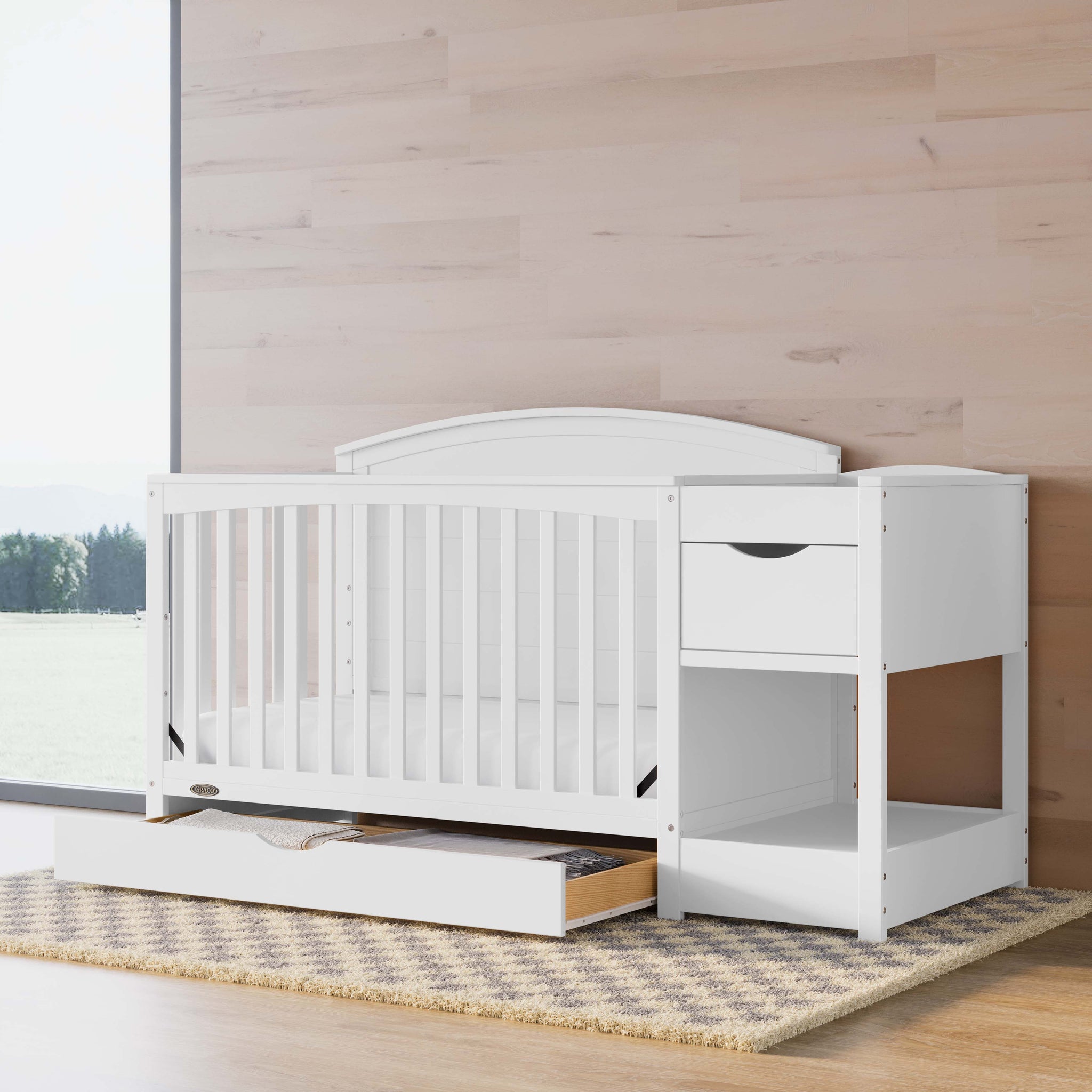white crib and changer in nursery