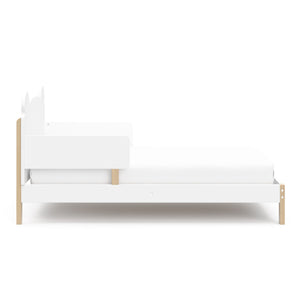 side view of white with driftwood toddler bed