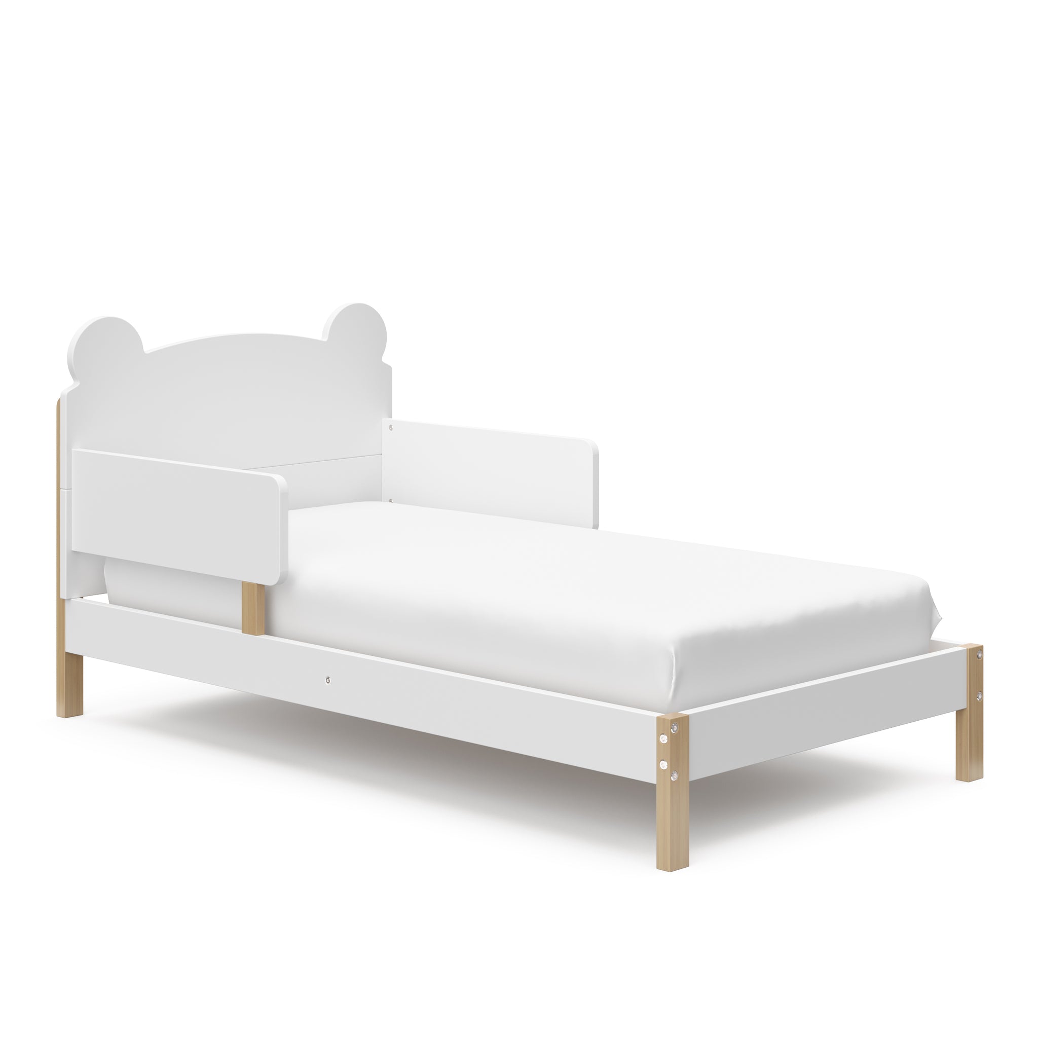 Angled view of white with driftwood toddler bed