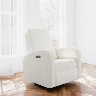 Ivory boucle reclining glider in a nursery