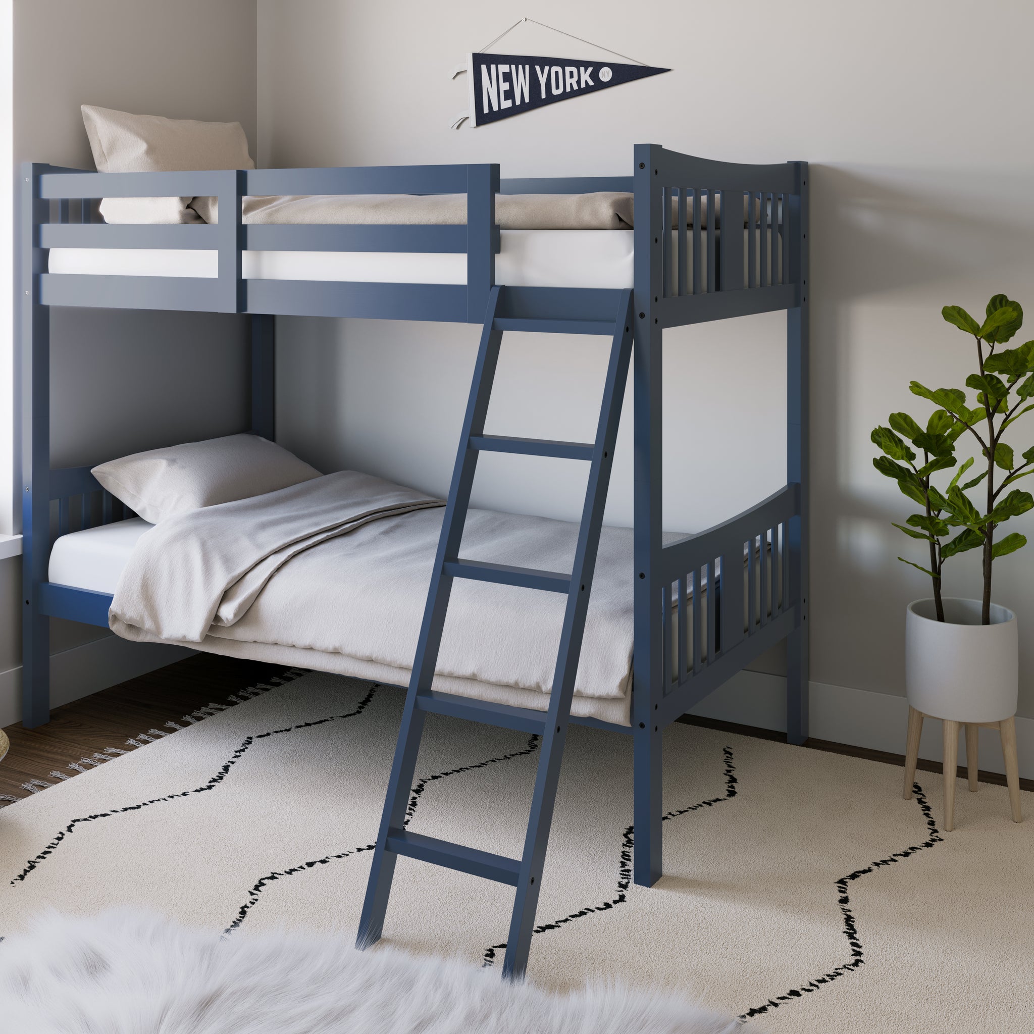  navy bunk bed with fixed ladder angled with bedding in a nursery