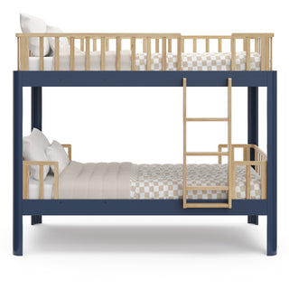 Side view of natural wood  and blue bunk bed with bedding