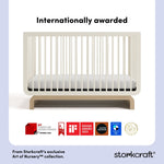 storkcraft frosted oat with driftwood crib with multiple award logos on bottom