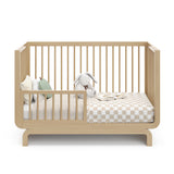 Storkcraft® Santorini® Deluxe 5-in-1 Convertible Crib with Bonus Toddler Guardrail.