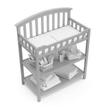 Graco® Changing Table with Bonus Water-Resistant Changing Pad.