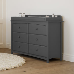 gray 6 drawer dresser in nursery with changing topper