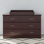 espresso changing topper on top of 6 drawer dresser in nursery