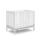 white mini crib angled view