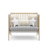 Graco® Teddi® 4-in-1 Convertible Mini Crib with Bonus Water-Resistant Mattress.
