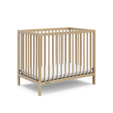 Graco® Teddi® 4-in-1 Convertible Mini Crib with Bonus Water-Resistant Mattress.