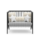 Graco® Teddi® 4-in-1 Convertible Mini Crib with Bonus Water-Resistant Mattress.