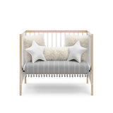 Graco® Teddi® 4-in-1 Convertible Mini Crib with Bonus Water-Resistant Mattress.