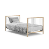 Graco® Teddi® 4-in-1 Convertible Mini Crib with Bonus Water-Resistant Mattress.
