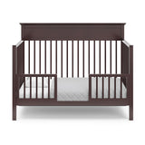 espresso crib in toddler bed conversion with two safety guardrails