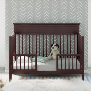 espresso crib in toddler bed conversion with guardrails, in nursery